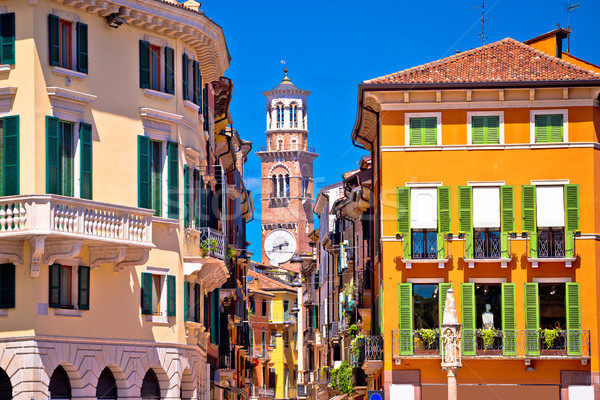 Verona colorful street and Lamberti tower view Stock photo © xbrchx