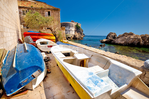 Colorful boat below Dubrovnik defense walls Stock photo © xbrchx