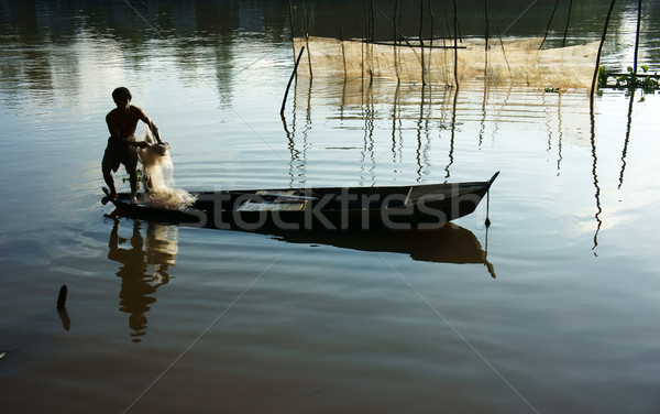 Pescador com rio belo reflexão silhueta Foto stock © xuanhuongho