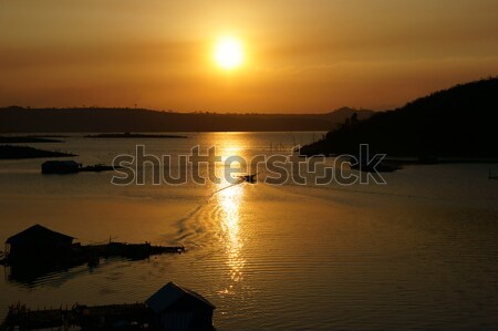 sunset on fishing village Stock photo © xuanhuongho