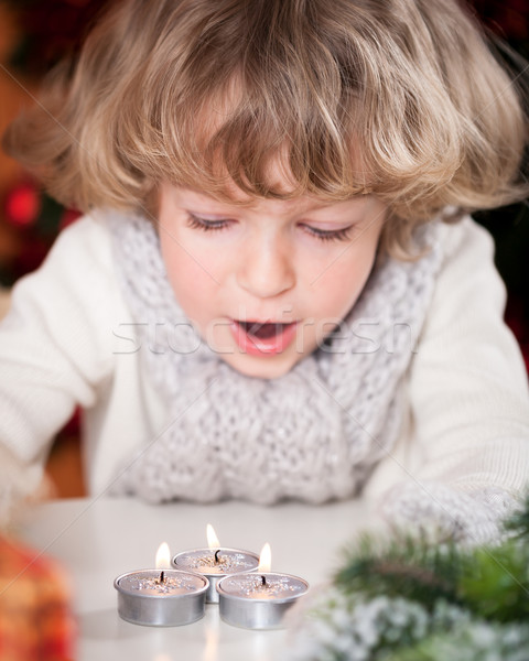 Beautiful child blowing out candles Stock photo © Yaruta