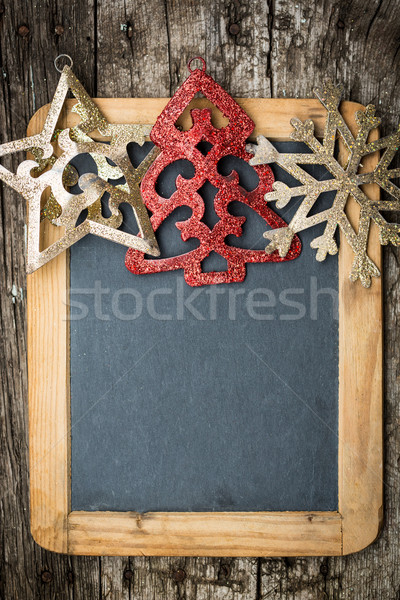 Stock photo: Christmas tree decorations border on vintage wooden blackboard