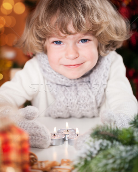 Smiling child with Christmas candles Stock photo © Yaruta