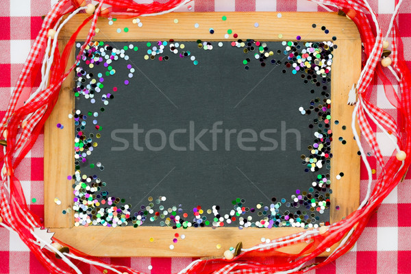 Vintage wooden blackboard with confetti  Stock photo © Yaruta