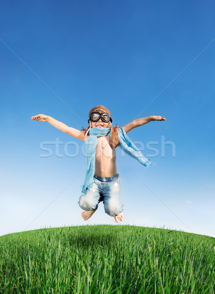 Boldog gyerek ugrik kint pilóta zöld Stock fotó © Yaruta