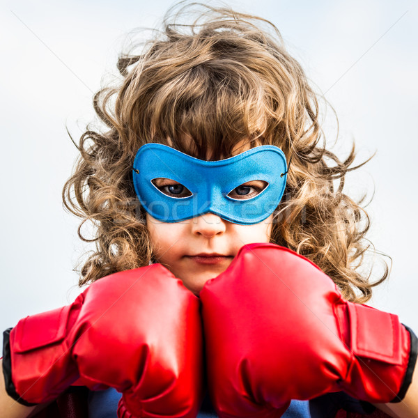 Szuperhős gyerek lány erő visel boxkesztyűk Stock fotó © Yaruta