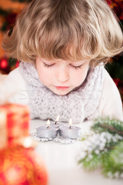 Child blowing out candles Stock photo © Yaruta