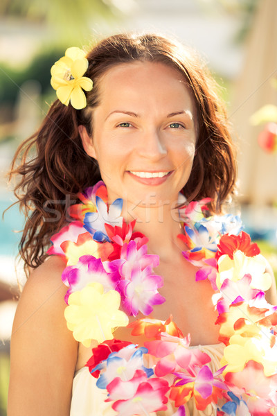 Stock photo: Woman in hawaiian flowers garland