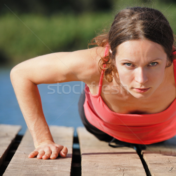 Woman doing push-ups Stock photo © Yaruta