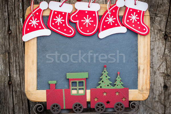 Christmas tree decorations border on vintage wooden blackboard Stock photo © Yaruta