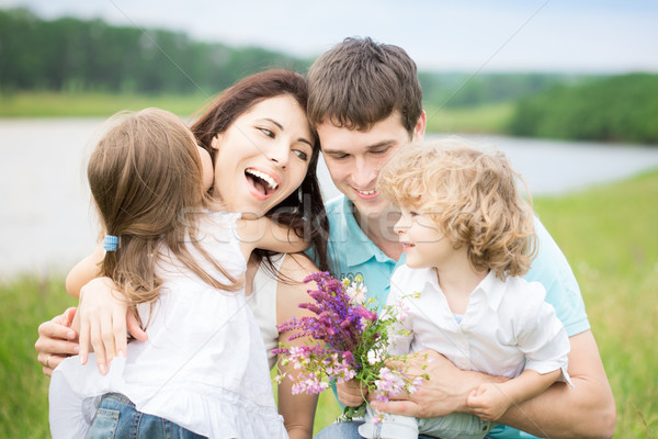 Família feliz primavera campo flores ao ar livre Foto stock © Yaruta