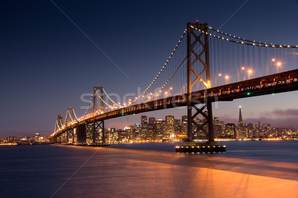 Dusk over Bay Bridge and San Francisco Skyline, California Stock photo © yhelfman