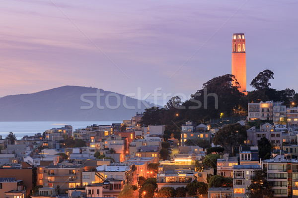 Coit Tower on Telegraph Hill with San Francisco Bay and Angel Island in the background at dusk. Stock photo © yhelfman