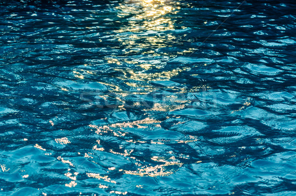 Stock photo: Blue water surface that reflects light.