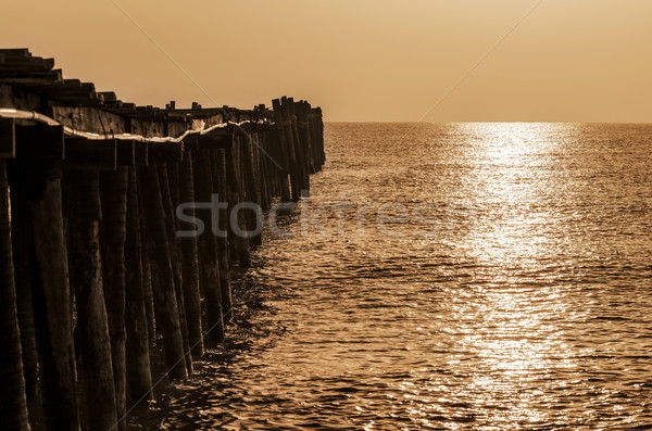 Old wooden bridge at sunrise with sepia Stock photo © Yongkiet