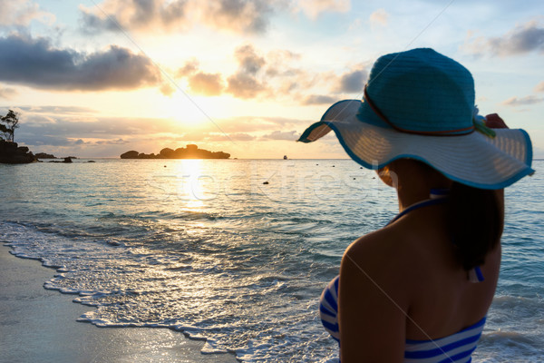 Girl on the beach at sunrise Stock photo © Yongkiet