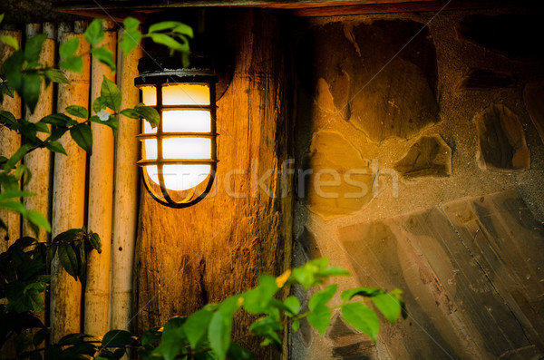 éjszaka lámpa lámpák kunyhó fal otthon Stock fotó © Yongkiet