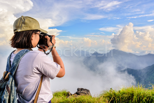 Hiker teens girl taking picture Stock photo © Yongkiet
