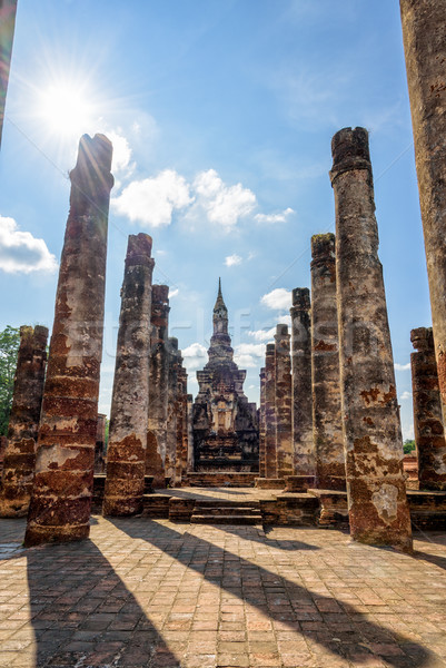 Ancient pagoda among the ruins pillars Stock photo © Yongkiet