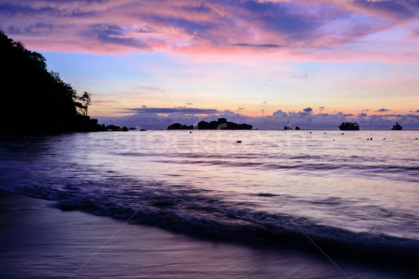 Beautiful sunrise at the beach Stock photo © Yongkiet