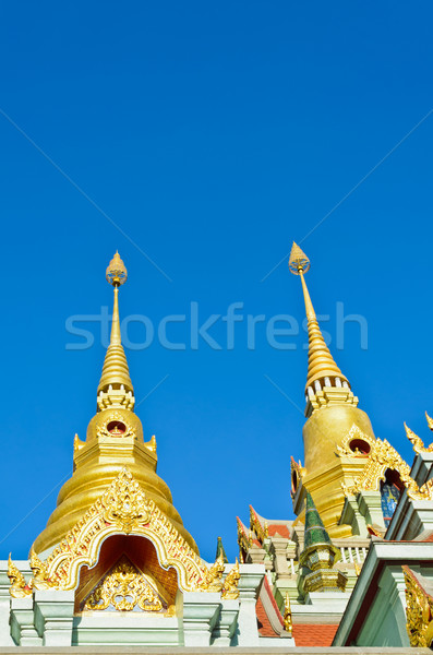 Golden pinnacle of thai temple Stock photo © Yongkiet