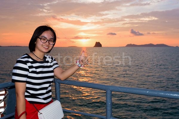 Women tourist cruising at sunset Stock photo © Yongkiet