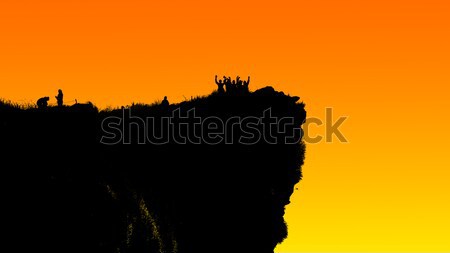 Silhouette woman on peak mountain Stock photo © Yongkiet