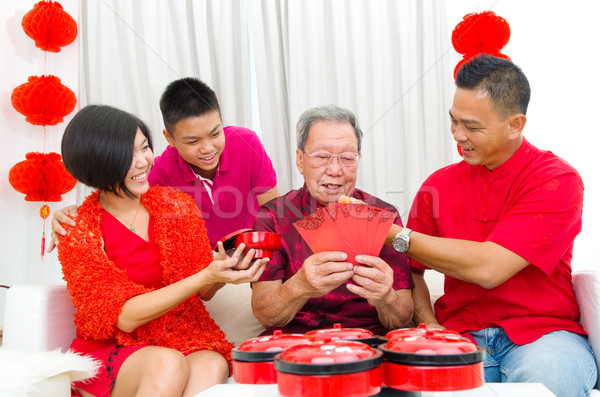 Asya aile üç nesiller kutlamak Stok fotoğraf © yongtick
