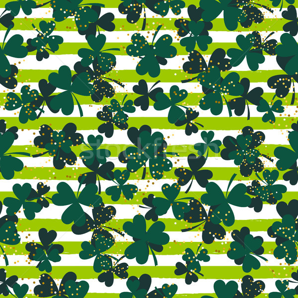 Shamrock green striped trefoil leaf seamless vector pattern. Stock photo © yopixart