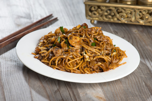 Fried Penang Char Kuey Teow which is a popular noodle dish in Ma Stock photo © yuliang11