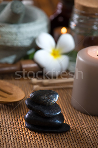 hot stone massage with spa treatment items on the background Stock photo © yuliang11