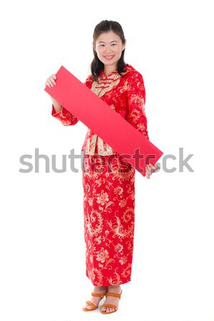 chinese new year girl greeting with ang pow sign for prosperity Stock photo © yuliang11