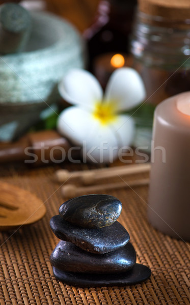 hot stone massage with spa treatment items on the background Stock photo © yuliang11