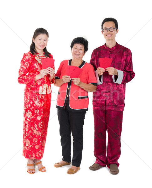 chinese new year family with ang pow symbol of luck Stock photo © yuliang11