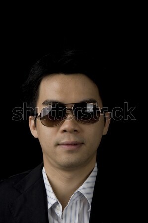 Giovani asian imprenditore buio occhiali nero Foto d'archivio © yuliang11