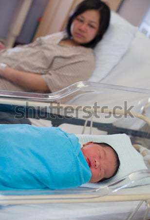 Asian chinese newborn baby girl and daddy in hospital Stock photo © yuliang11