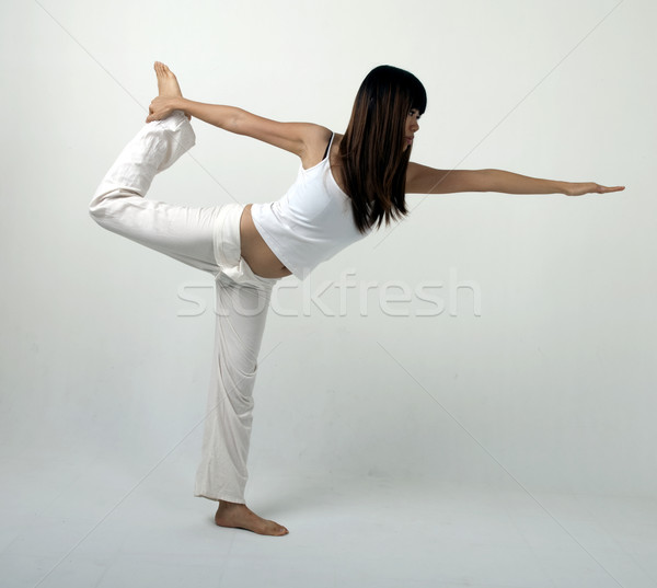 Yoga asian ragazza stand posizione Foto d'archivio © yuliang11