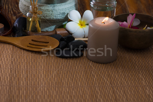 tropical spa setup with frangipani flower hot rocks and massage  Stock photo © yuliang11