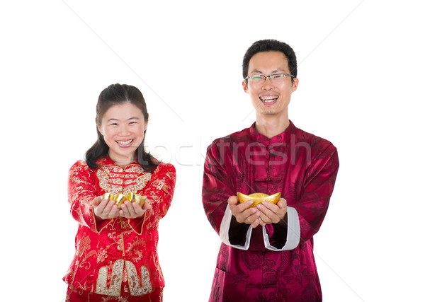 chinese new year couple with gold coins during festival Stock photo © yuliang11