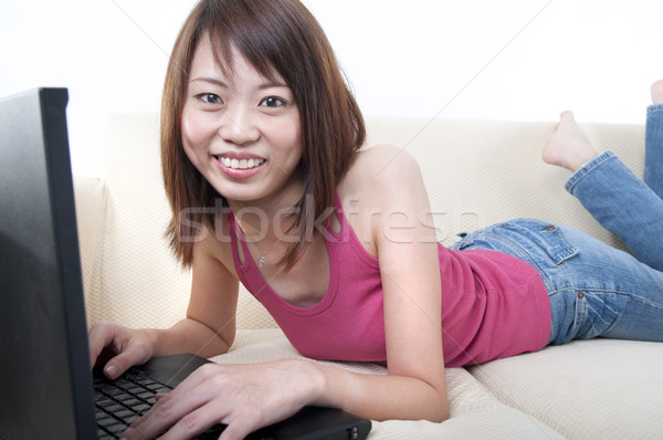 asian girl on laptop Stock photo © yuliang11