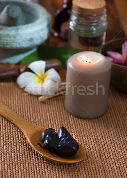 hot stone massage with spa treatment items on the background Stock photo © yuliang11