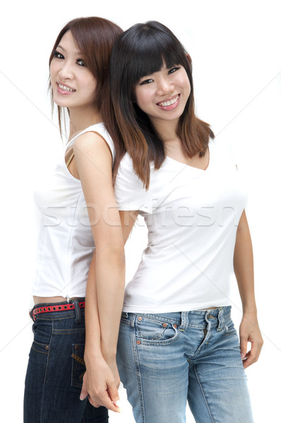Due asian ragazze isolato bianco Foto d'archivio © yuliang11