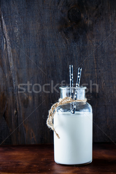 Rustic milk in glass jar Stock photo © YuliyaGontar