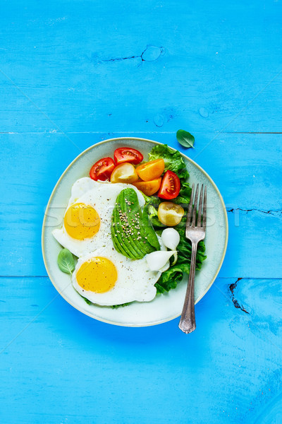 Fried eggs and vegetables Stock photo © YuliyaGontar