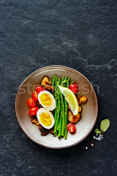 Aspargus and egg on plate Stock photo © YuliyaGontar