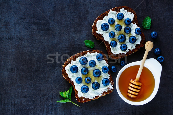 Ricotta, blueberries and honey sandwiches Stock photo © YuliyaGontar