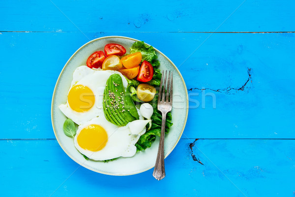 Fried eggs and vegetables Stock photo © YuliyaGontar