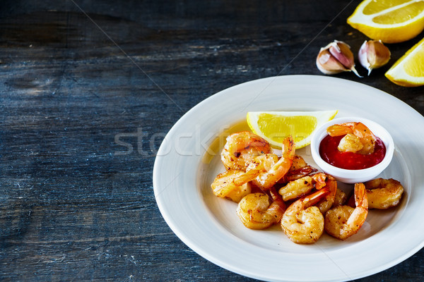 Roasted prawns with sauce Stock photo © YuliyaGontar