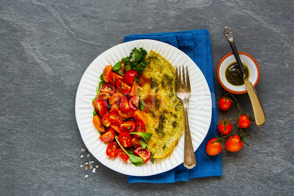 Omelette with arugula and tomatoes salad Stock photo © YuliyaGontar