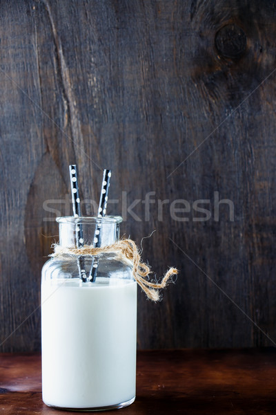 Rustic milk in glass jar Stock photo © YuliyaGontar